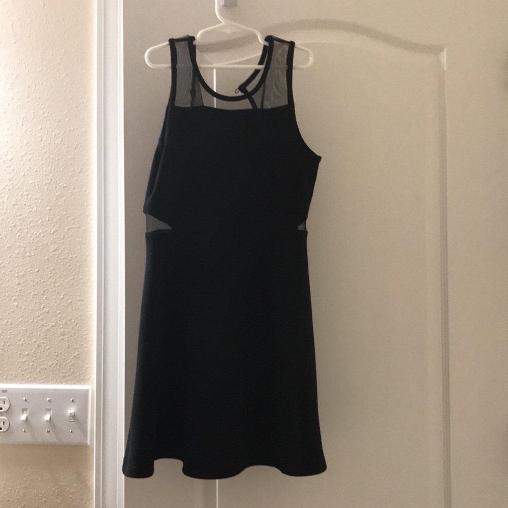 Elegant black dress with mesh cutouts